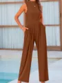 Sleeveless solid color wide-leg jumpsuit with pockets, casual elegant summer fashion detail view. - Brown
