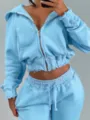 Light blue cropped zip hoodie and sweatpants set detail, raw edge casual streetwear style. - Sky Blue