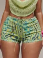 Detail shot of high-waist tie-dye lace-up shorts, front metal eyelets and drawstring. - S / Bottoms / Mint Green
