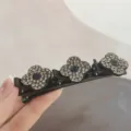 Black triple clover rhinestone duckbill hair clip for elegant side hair styling. - Grayish Blue