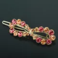 Elegant crystal hair clip with vibrant red and orange rhinestones, perfect for daily styling. - QWJ003 Champagne Pink