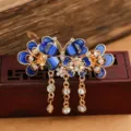 Vintage blue butterfly hair claw clip with sparkling rhinestones and elegant hanging tassels. - Butterfly Tassel Hair Claw / Blue