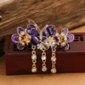 Vintage butterfly hair claw clip with purple enamel and rhinestone tassels for elegant hairstyles. - Butterfly Tassel Hair Claw / Purple