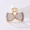Korean rhinestone acetate hair claw clip, elegant bow shark clip for daily hair styling. - White