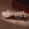 Elegant bow rhinestone hair clip for women, sparkling crystal spring barrette hairpin accessory. - BPB65-1 / Champagne