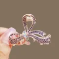 Rose gold rhinestone bow hair claw clip, medium elegant crystal shark clip for stylish hair. - Purple
