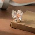 Elegant rhinestone butterfly hair claw clip in rose gold, perfect for daily hair styling. - White
