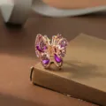 Medium butterfly hair claw clip with purple rhinestones and rose gold alloy finish for daily wear. - Purple