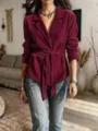 Detailed view of the burgundy corduroy belted blazer, featuring lapel and long sleeves. - S / Tops / Burgundy