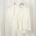 White knitted hollow fringe triangular shawl scarf versatile elegant fashion accessory for women. - White