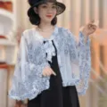 Sheer sun protection shawl for women, stylish blue floral printed cape with ruffle sleeves and bow. - Blue and White Porcelain