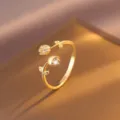 Exquisite gold-plated flower ring detail, featuring sparkling cubic zirconia and chic design. - Inlaid Tulip Ring