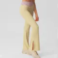 High-waist flared yoga pants with polka dot waistband and side slit, comfortable activewear. - S / Bottoms / Pink Yellow Polka Dot