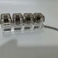 Mechanical keyboard switch fidget toy keychain, 4-in-1 clear keycaps portable stress relief. - No Light / 4 Cavity Black