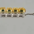 Mechanical keyboard switch fidget toy keychain with glowing yellow translucent keycaps - No Light / Yellow
