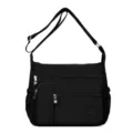 Borsa a tracolla nera in nylon da donna, leggera, con tasche multiple per uso quotidiano. - Nero
