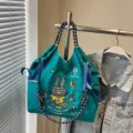 Large capacity canvas tote bag with cute cartoon rabbit embroidery and casual shoulder design. - Green