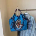 Large capacity blue canvas shoulder bag with unique rope handles and lion embroidery for daily commuting. - 40*10*35 / Dark Blue