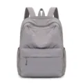 Zaino casual in nylon grigio, variante minimalista con tasca frontale e comode bretelle. - 30*15*40cm / Grigio biancastro