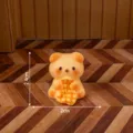 Cute resin bear miniature figurine holding waffle for DIY micro landscape desktop decor - Matte Quilt Holding Dog Style