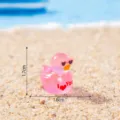 Cute pink resin duck miniature figurine with heart sunglasses and love text for DIY decor. - Glossy Rose Red
