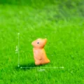 Miniature resin dinosaur figurine, cute cartoon animal charm for DIY craft decor and micro landscape. - Glossy Orange Pterosaur