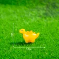 Mini yellow resin dinosaur figurine, cute cartoon DIY craft accessory variant for decoration. - Glossy Yellow Stegosaurus
