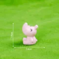 Mini pink resin rhinoceros figurine, cute matte animal desktop ornament for DIY craft decor. - Pink