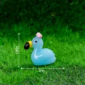 Miniatura fenicottero blu in resina con fiocco rosa, perfetto accessorio fai da te 2cm - Jelly Luminoso Blu