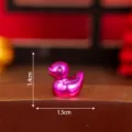 Miniature electroplated pink resin duck figurine, perfect for DIY crafts and desktop decor. - Glossy Purple