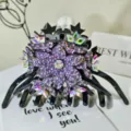 Detailed close up of luxury rhinestone hair claw clip with purple crystal floral design. - Colorful Crystal Rhinestone