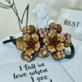 Rhinestone flower hair claw clip, sparkling crystal floral twist clip, elegant hair accessory variant. - Style 34