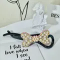 Black banana hair clip featuring a stunning rhinestone and pearl bow design for women. - Style 38