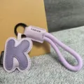 Leather alphabet K keychain with braided lanyard and metal ring, stylish bag charm. - Letter K