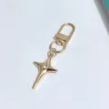 Gold four-pointed star alloy keychain bag charm with crystal detail, trendy DIY accessory. - Rhinestone Four-Pointed Star Clasp Style / Gold