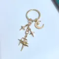 Portachiavi stella a quattro punte e luna in lega dorata, ciondolo borsa elegante e alla moda. - Stile Stella a Quattro Punte Luna (5#) / Oro