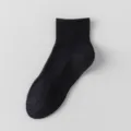 Solid black ankle socks for men and women, breathable casual short socks, daily sports wear. - Solid Arch Support Crew Socks / Black