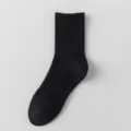 Black ribbed crew socks for men and women, comfortable cotton solid color sports socks. - Solid Arch Support Long Socks / Black