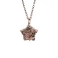 Close up detail shot of a natural stone star wire wrapped tree of life pendant necklace. - Antique Copper + Rhodonite