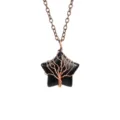 Close-up detail of the black crystal star pendant wrapped with copper wire tree design. - Antique Copper + Obsidian