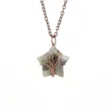 Close-up of a handmade wire-wrapped crystal star pendant necklace with copper chain. - Antique Copper + Labradorite