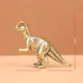 Brass dinosaur figurine detail shot showing compact size and vintage texture craftsmanship. - Dilophosaurus