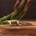 Close-up of a retro brass crocodile figurine tea pet, perfect for office desktop decor and collection. - Crocodile Style / Bronze