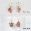 Handmade raw crystal stone drop earrings with wire wrap design, available in gold and silver colors. - Gold Wire Wrapped Style / Strawberry Quartz