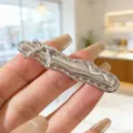 Barrette à cheveux en métal argenté avec nœud chic et design fluide, idéale pour la frange. - Nœud Argenté 1Pc