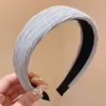 Close-up view of the elegant pleated grey headband, showing soft fabric texture and inner lining. - Blue Wide Pleated Hair Tie