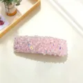 Detail of pink crystal hair clip, sparkling rhinestone surface texture close-up shot - Square Style / Pink