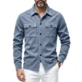 Close-up detail of mens blue suede shirt jacket, showcasing dual chest pockets and buttons. - S / Tops / Light Blue