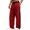 Detailed view of men's side-stripe fleece-lined wide-leg sweatpants, casual sports comfort. - S / Bottoms / Bright Red