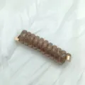 Brown translucent telephone cord hair tie with gold tone metal ends for daily use daily styling. - Brown Telephone Wire